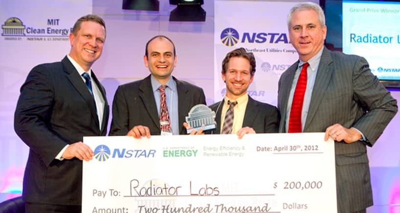 Taken in 2012, John Kymissis (center left) with Marshall Cox (center right), after winning the grand prize in the MIT Clean Energy startup competition. Credit: John Kymissis