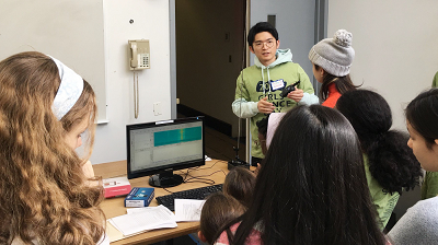 Tingjun demonstrating the principles of wireless communications using a walkie-talkie at the Columbia Girls’ Science Day Tingjun demonstrating the principles of wireless communications using a walkie-talkie at the Columbia Girls’ Science Day