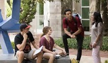 students sitting outside