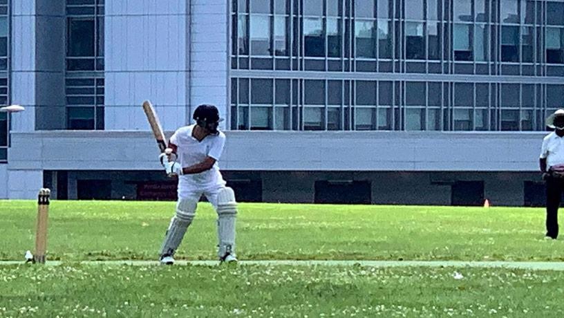 Person playing cricket