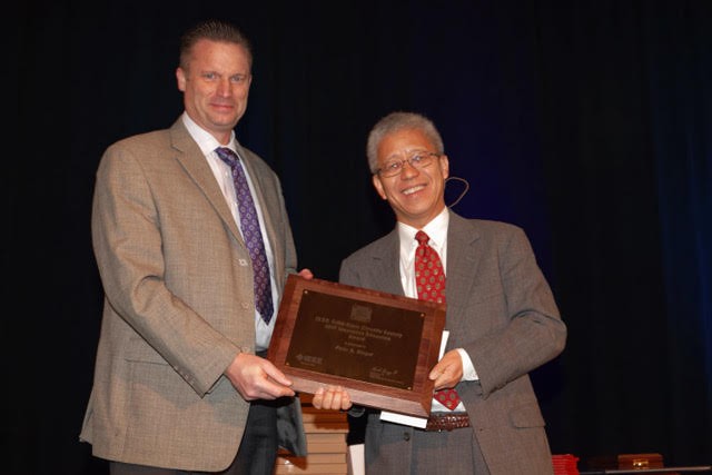 Award given to Peter Kinget by Kenneth O, President, IEEE SSCS 
