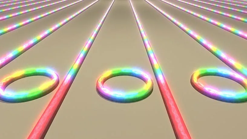 Illustration showing an array of microring resonators on a chip converting laser light into frequency combs.