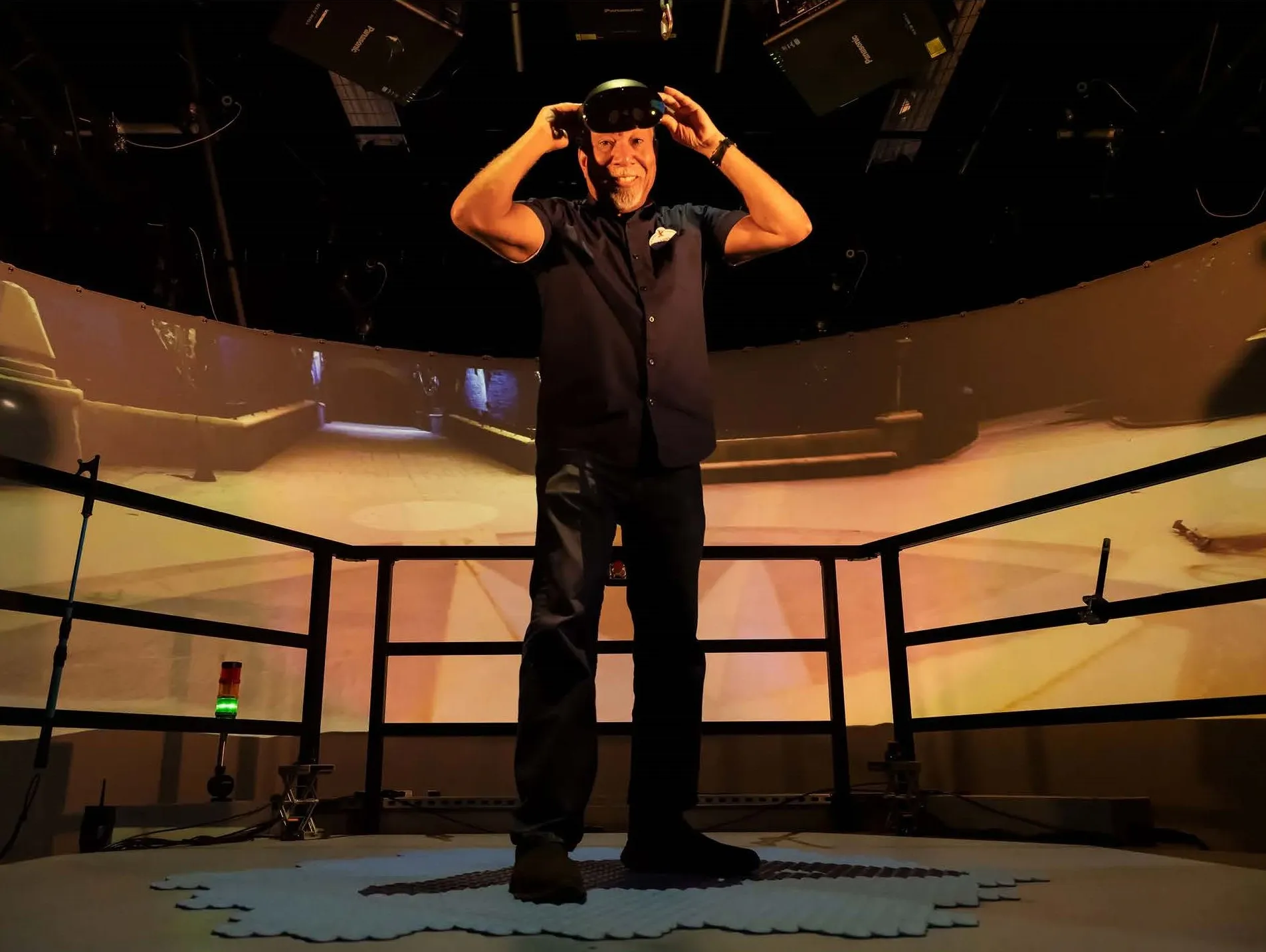 Lanny Smoot stands on one of his latest inventions: the HoloTile Floor. PHOTOGRAPH: SIMONE NIAMANI THOMPSON 